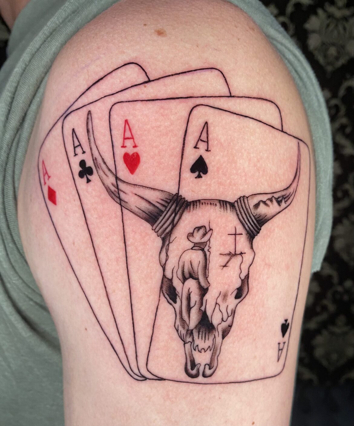 Four of a kind ace of spades tattoo with a skull performed by Basic Urban Witch Tattoo and Tarot in Fort Collins Colorado.