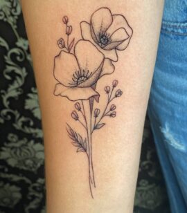 A pair of minimalist single needle flowers tattooed by Basic Urban Witch Tattoo and Tarot in Fort Collins Colorado.